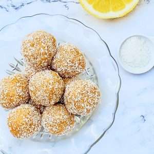 Read more about the article Easy Gluten, Nut & Dairy Free Lemon Coconut Balls (Vegan)