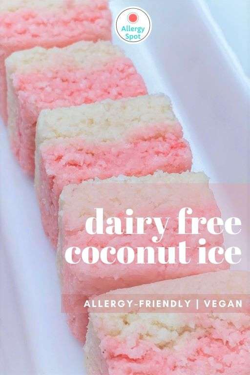 pink and white dairy free coconut ice slice squares in a quite dish with allergy-friendly and vegan labels
