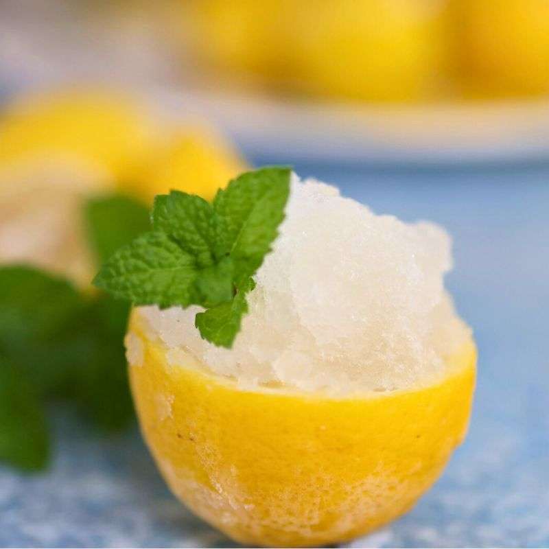 lemon granita Italian lemon ice served in half a lemon with mint