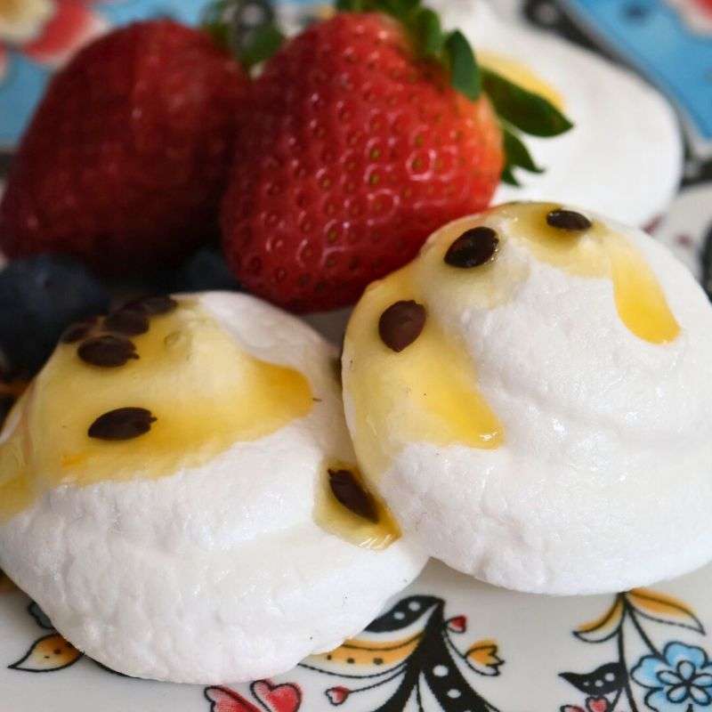 vegan egg free meringues with strawberries and passionfruit